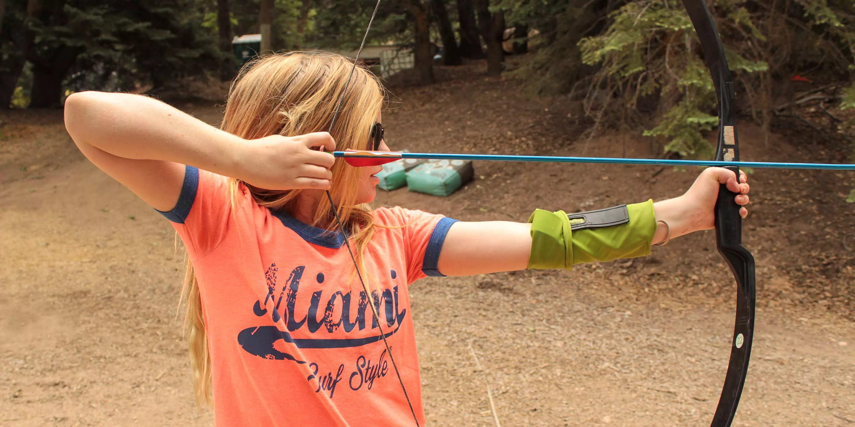 Girl shooting an archery arrow