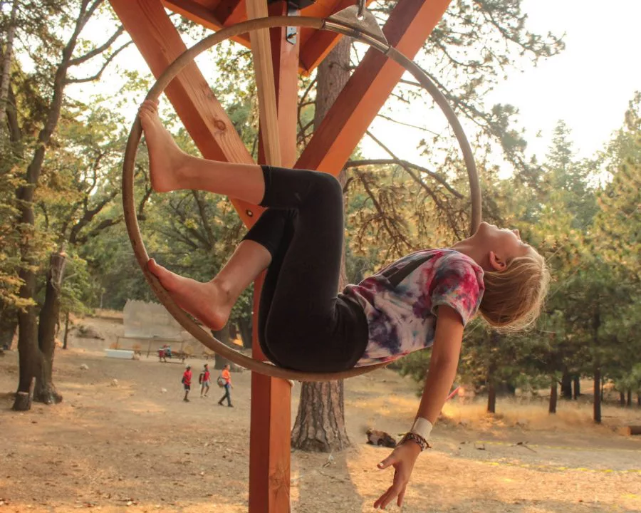 Girl on trapeze hoop