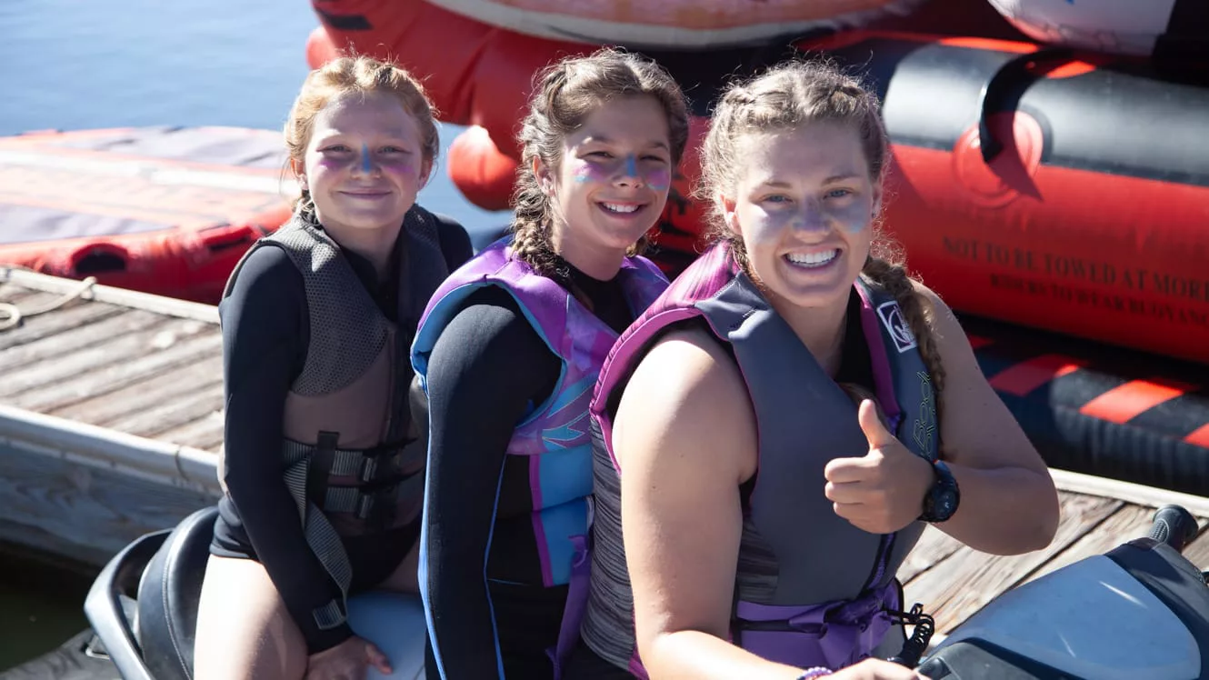 Girls on parked jet ski