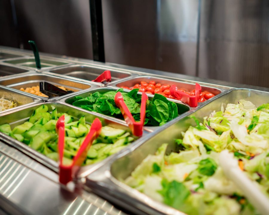 Salad bar with lettuces and vegetables