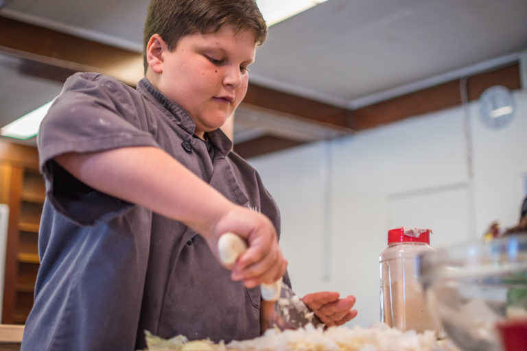 a boy making food