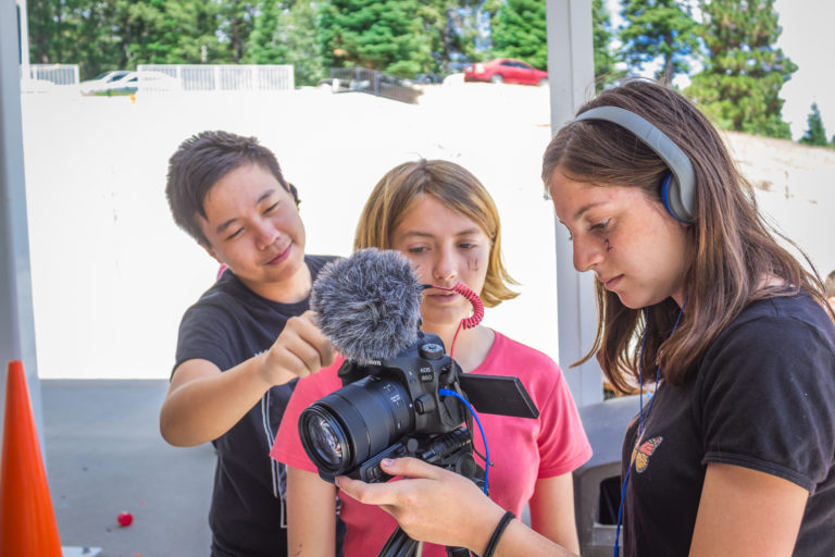 kids using a film camera