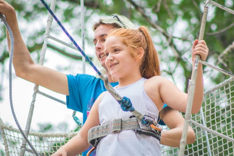 a girl getting ready to perform on the flying trapeze