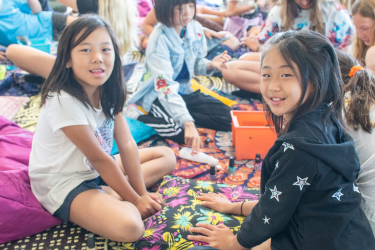 two girls working on crafts together