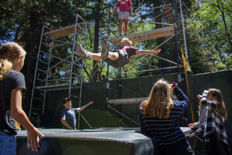 a boy performing a stunt fall