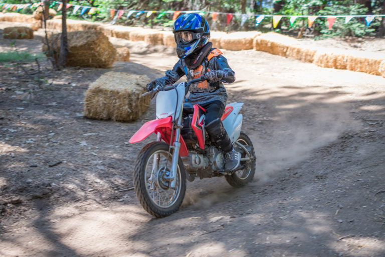 a camper riding a dirt bike