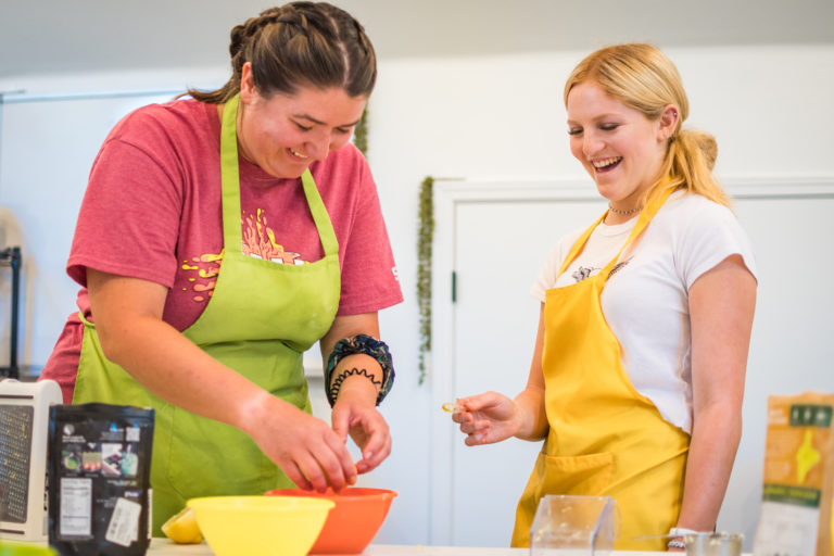 two girls making soap