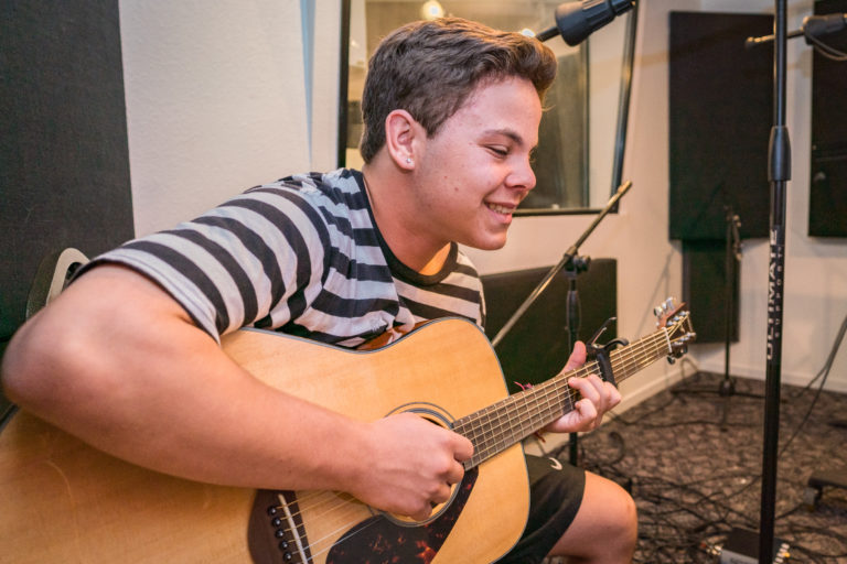 a boy playing guitar