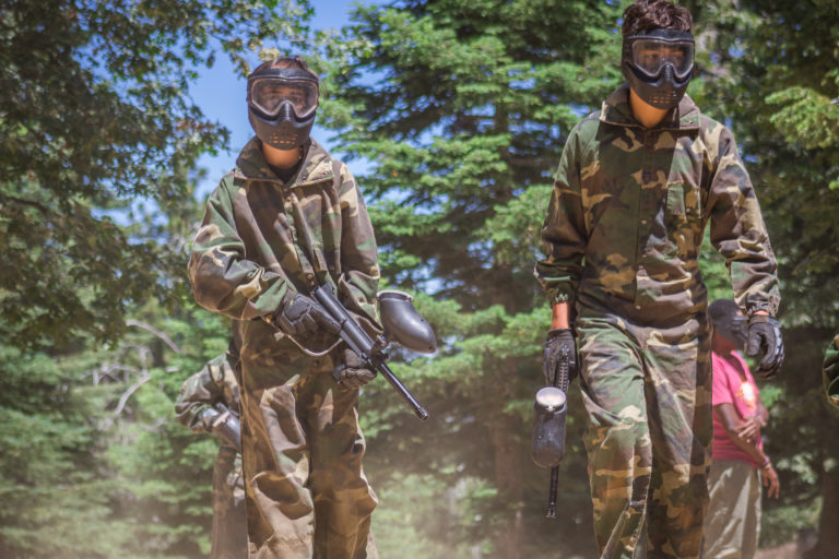 two boys with paint ball guns