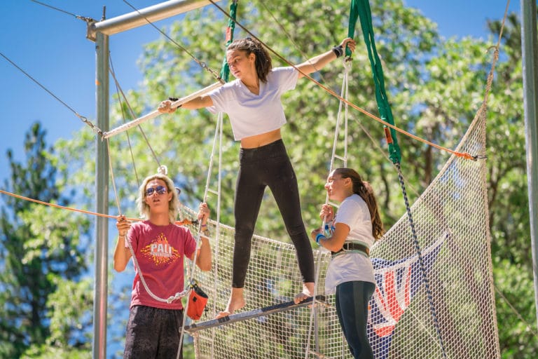 girl learning trapeze