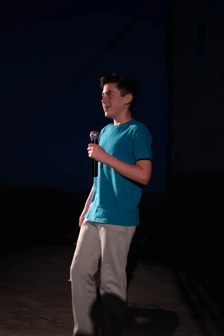 kid performing at comedy camp