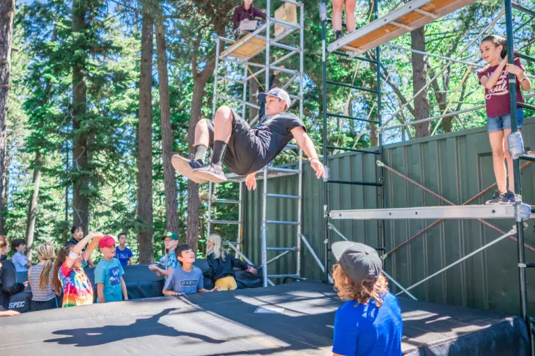 kids learning stunt techniques at camp