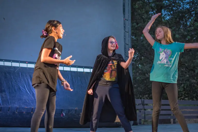 girls acting on stage at summer camp