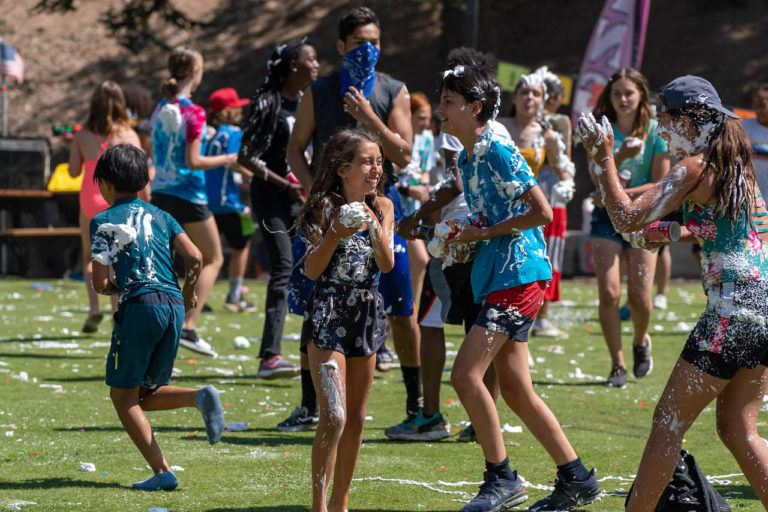 group of campers playing at foam party