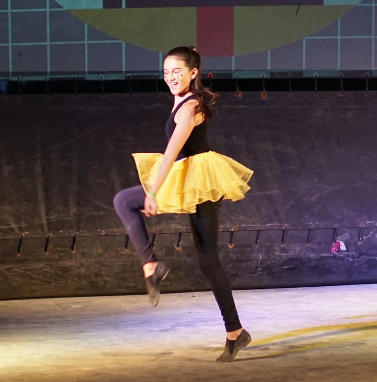 girl dancing in yellow tutu