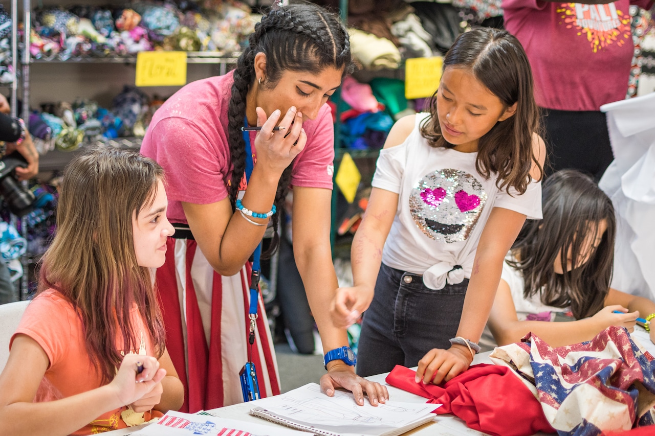 Girls learning at fashion camp