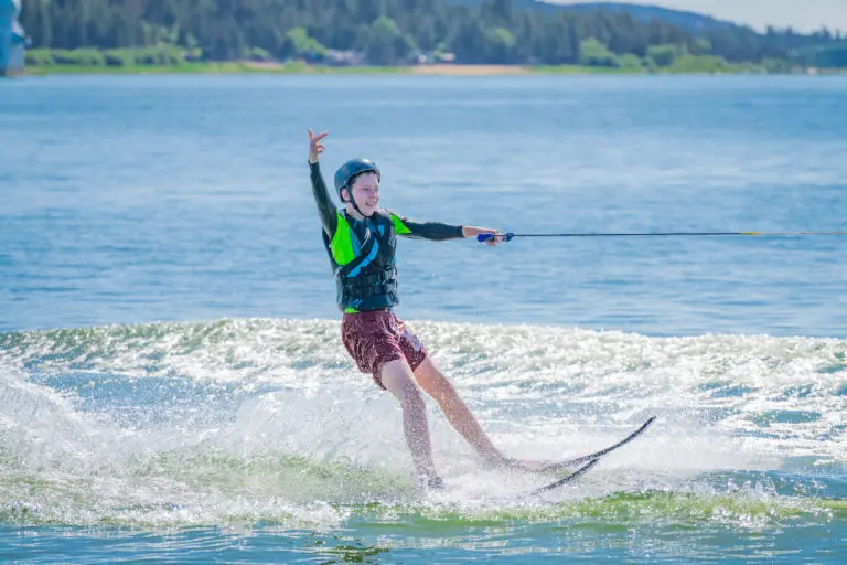 boy water skiing on lake at summer camp